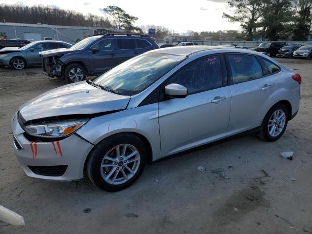 FORD FOCUS SE 2018 with VIN 1FADP3F29JL285276 - Photo from auction