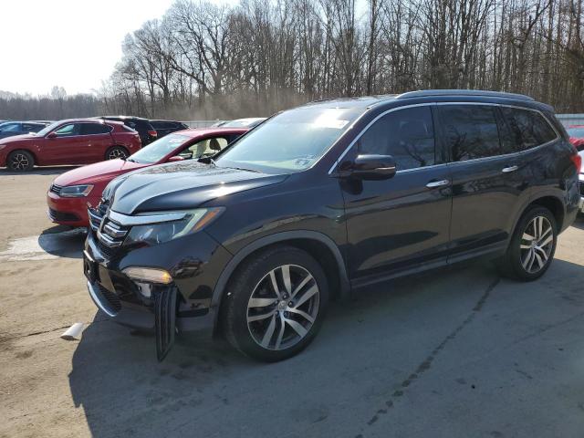 HONDA PILOT TOUR 2017 with VIN 5FNYF6H91HB002764 - Photo from auction
