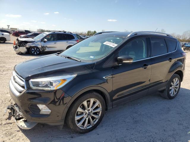 FORD ESCAPE TIT 2017 with VIN 1FMCU0J98HUD86911 - Photo from auction