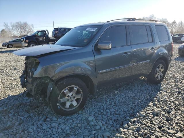 HONDA PILOT TOUR 2011 with VIN 5FNYF4H92BB009072 - Photo from auction