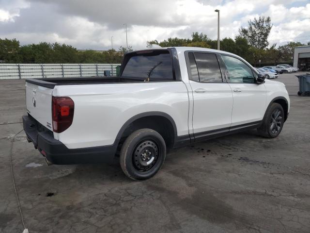 Photo 3 from auction – 2023 HONDA RIDGELINE with VIN 5FPYK3F13PB047993