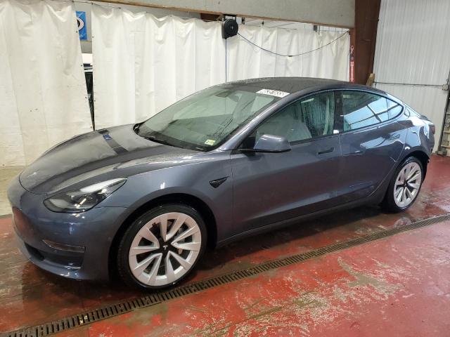 TESLA MODEL 3 2022 with VIN 5YJ3E1EAXNF369690 - Photo from auction