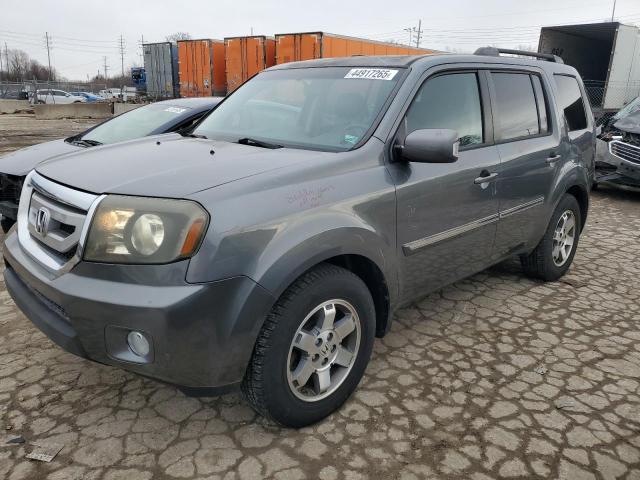 HONDA PILOT TOUR 2011 with VIN 5FNYF4H95BB087913 - Photo from auction