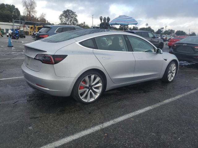 Снимка 3 от търг – 2018 TESLA MODEL 3 с VIN 5YJ3E1EB2JF072111