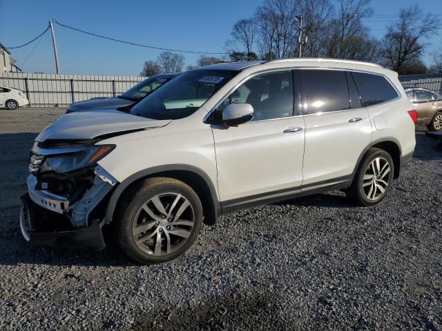 HONDA PILOT TOUR 2016 with VIN 5FNYF6H97GB125984 - Photo from auction