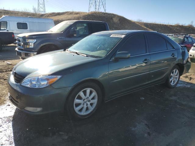 TOYOTA CAMRY LE 2004 with VIN 4T1BF32K84U077992 - Photo from auction