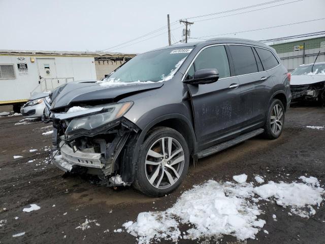 HONDA PILOT TOUR 2016 with VIN 5FNYF6H92GB053592 - Photo from auction