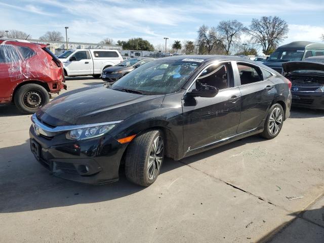 HONDA CIVIC EX 2018 with VIN JHMFC1F32JX020248 - Photo from auction