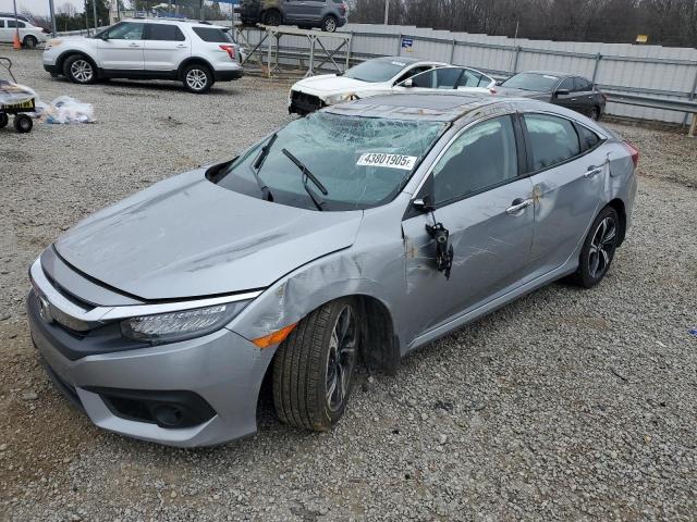 HONDA CIVIC TOUR 2017 with VIN 19XFC1F92HE030987 - Photo from auction