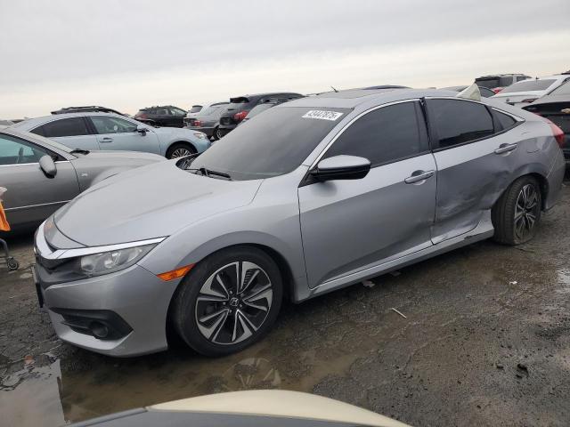 HONDA CIVIC EXL 2018 with VIN 2HGFC1F76JH641521 - Photo from auction