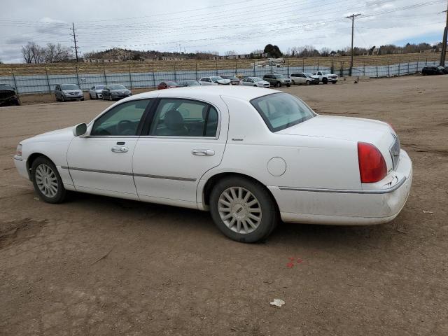 Photo 2 from auction – 2004 LINCOLN TOWN CAR E with VIN 1LNHM81W24Y613734