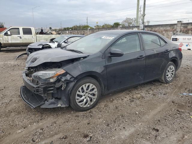 TOYOTA COROLLA L 2019 with VIN 5YFBURHE7KP898221 - Photo from auction