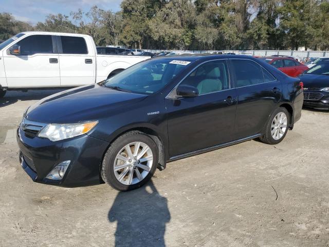TOYOTA CAMRY HYBR 2012 with VIN 4T1BD1FK8CU028407 - Photo from auction