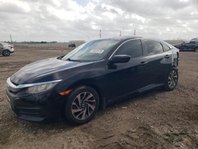 HONDA CIVIC EX 2018 with VIN 19XFC2F79JE031970 - Photo from auction