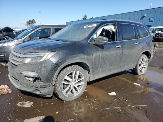 HONDA PILOT TOUR 2016 with VIN 5FNYF6H93GB049678 - Photo from auction