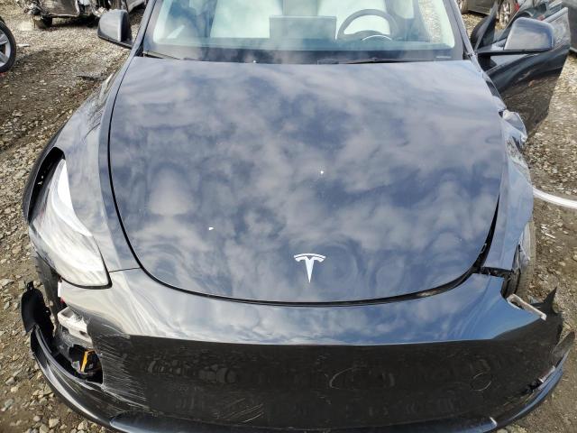 Photo 11 from auction – 2024 TESLA MODEL Y with VIN 7SAYGAEEXRF990438