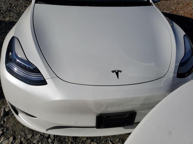 Photo 11 from auction – 2022 TESLA MODEL Y with VIN 7SAYGAEEXNF508254