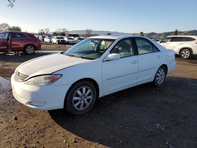 TOYOTA CAMRY LE 2002 with VIN JTDBE32K620061382 - Photo from auction