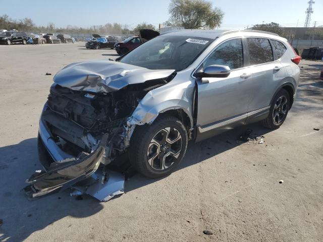 HONDA CR-V 2017 with VIN 5J6RW1H99HL009850 - Photo from auction