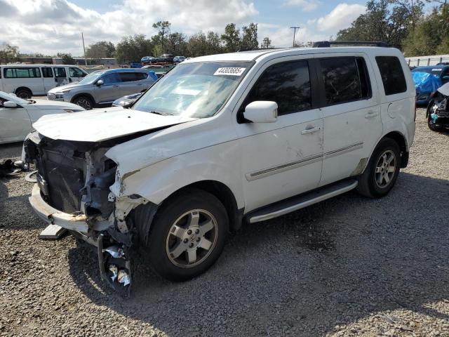 HONDA PILOT TOUR 2010 with VIN 5FNYF3H94AB021152 - Photo from auction