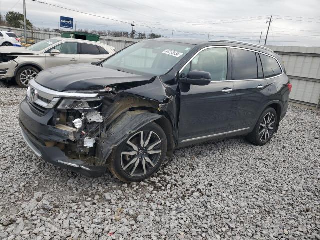 HONDA PILOT TOUR 2020 with VIN 5FNYF5H67LB019190 - Photo from auction