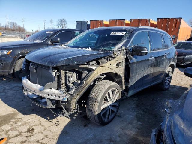 HONDA PILOT TOUR 2017 with VIN 5FNYF6H90HB045184 - Photo from auction