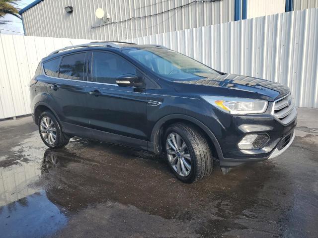 Photo 4 from auction – 2018 FORD ESCAPE TIT with VIN 1FMCU0J99JUD34337