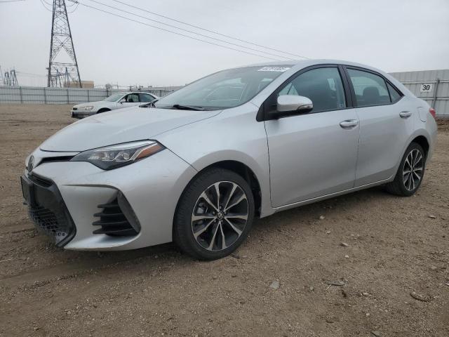 TOYOTA COROLLA L 2017 with VIN 5YFBURHE7HP591785 - Photo from auction
