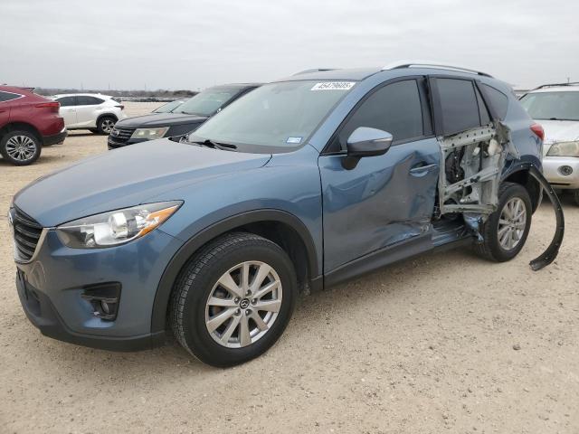 MAZDA CX-5 TOURI 2016 with VIN JM3KE2CY4G0900831 - Photo from auction