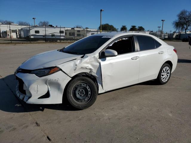 TOYOTA COROLLA L 2018 with VIN 5YFBURHE7JP758863 - Photo from auction