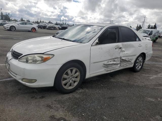 TOYOTA CAMRY LE 2003 with VIN JTDBF32KX30149382 - Photo from auction