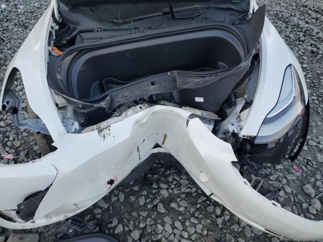 Photo 11 from auction – 2023 TESLA MODEL Y with VIN 7SAYGDEE4PA100043