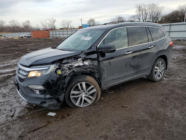 HONDA PILOT TOUR 2018 with VIN 5FNYF6H90JB042422 - Photo from auction