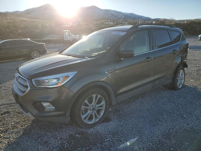 FORD ESCAPE SE 2018 with VIN 1FMCU9GD8JUC61154 - Photo from auction