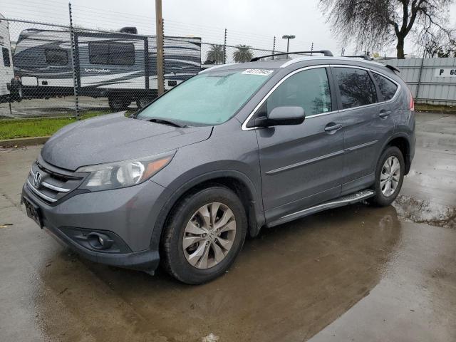 HONDA CR-V EXL 2014 with VIN 2HKRM4H75EH601824 - Photo from auction