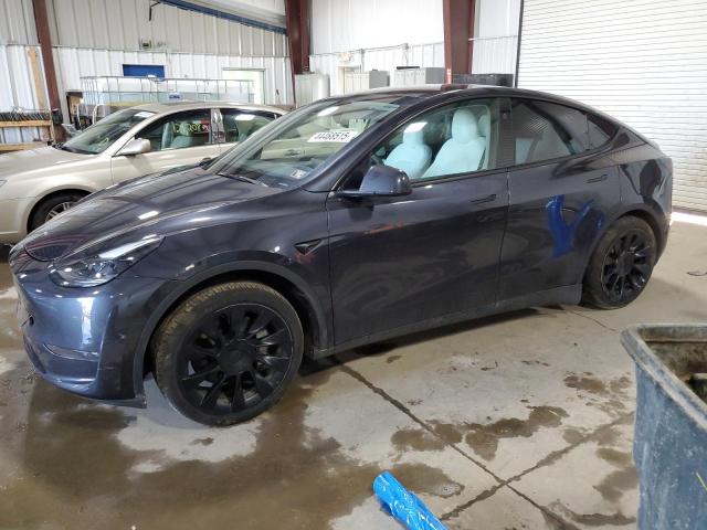 TESLA MODEL Y 2024 with VIN 7SAYGAEEXRF077064 - Photo from auction