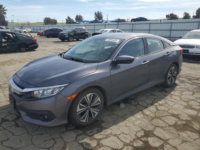 HONDA CIVIC EX 2017 with VIN 2HGFC1F35HH638388 - Photo from auction