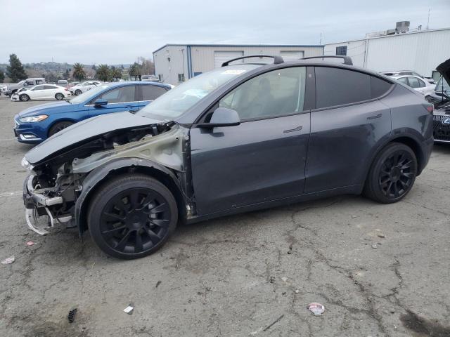 TESLA MODEL Y 2022 with VIN 7SAYGDEE0NF369849 - Photo from auction