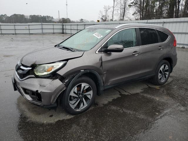 HONDA CR-V TOURI 2015 with VIN 5J6RM3H97FL013099 - Photo from auction