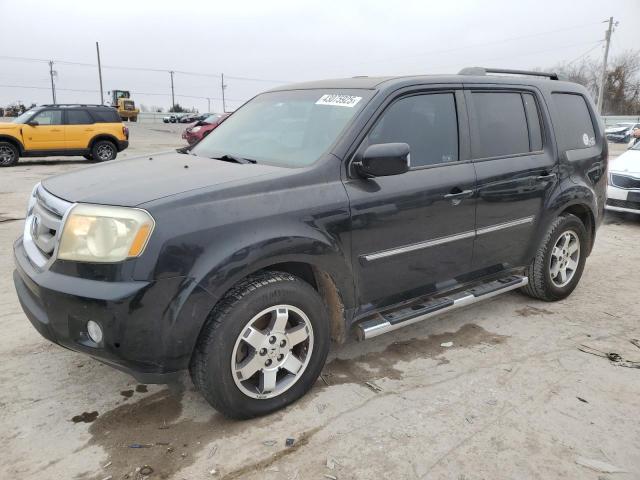 HONDA PILOT TOUR 2010 with VIN 5FNYF4H89AB036355 - Photo from auction