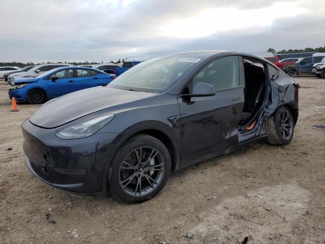 TESLA MODEL Y 2024 with VIN 7SAYGDED9RA305643 - Photo from auction