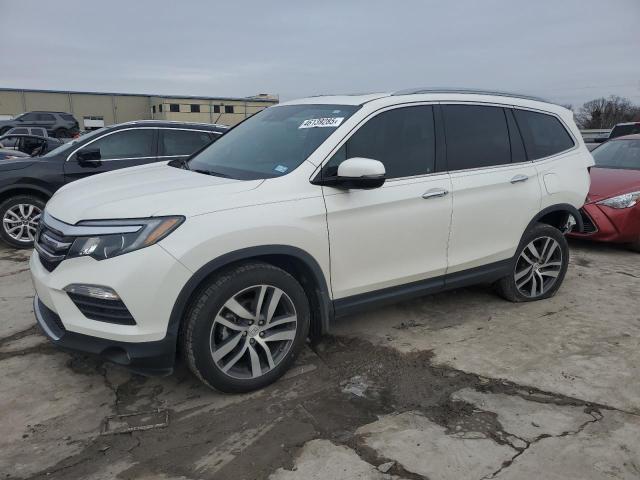 HONDA PILOT TOUR 2017 with VIN 5FNYF5H97HB047668 - Photo from auction