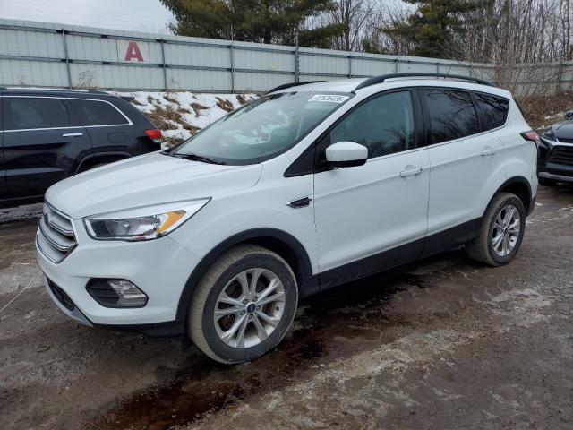 FORD ESCAPE SE 2018 with VIN 1FMCU9GD9JUD38226 - Photo from auction