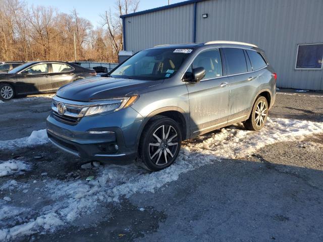 HONDA PILOT TOUR 2019 with VIN 5FNYF6H63KB019272 - Photo from auction