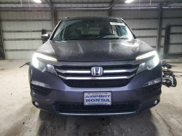 Photo 5 from auction – 2018 HONDA PILOT ELIT with VIN 5FNYF6H06JB069948