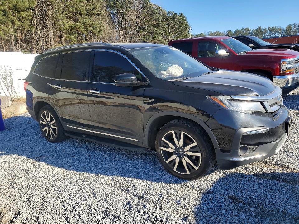 Photo 4 from auction – 2021 HONDA PILOT TOUR with VIN 5FNYF5H63MB000122
