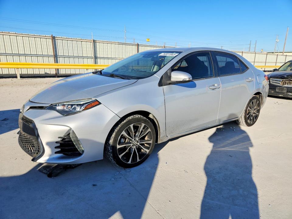 TOYOTA COROLLA 2018 with VIN 5YFBURHE9JP770867 - Photo from auction