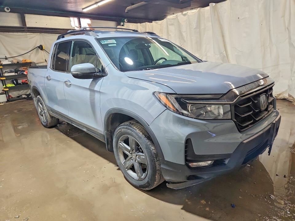 Photo 4 from auction – 2022 HONDA RIDGELINE with VIN 5FPYK3F7XNB019237