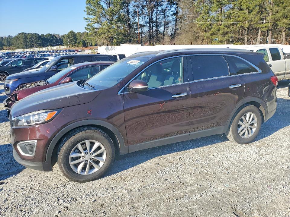 KIA SORENTO LX 2016 with VIN 5XYPG4A31GG014715 - Photo from auction