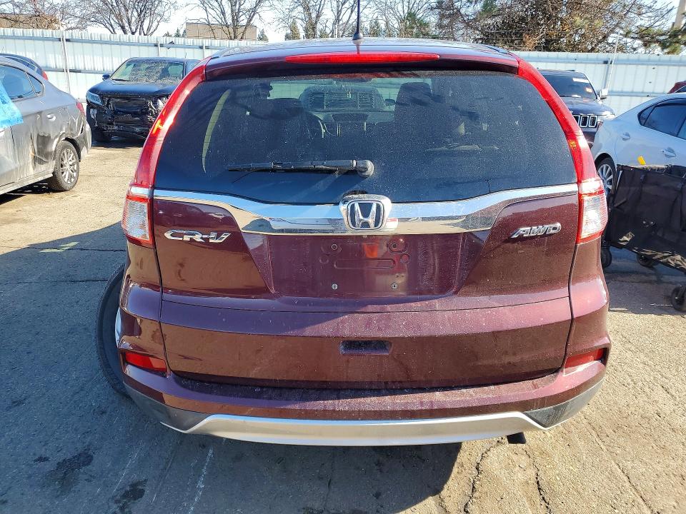 Photo 6 from auction – 2015 HONDA CR-V with VIN 2HKRM4H5XFH628307